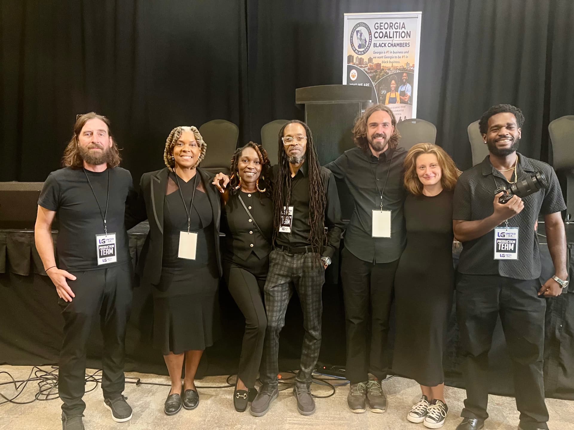 United GA Entertainment event crew wearing production-team credentials at a Georgia Coalition of Black Chambers event.
